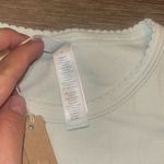 SKIMS Ivory DROP NEEDLE POINTELLE BABY TEE Photo 3