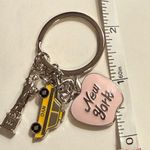 design USA Keychain - new - New York - dainty - pink apple, yellow taxi cab, silver statue of liberty. Enamel on metal. Charms are approx 1" each - see pics for measurements. Brand is . Photo 4