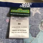 Sesame Street  cookie monster in wonderland winter scrub top women's size M Photo 1