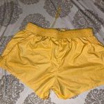 Nike Women’s  yellow parachute shorts  Photo 1