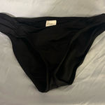black bathing suit bottoms Photo 0