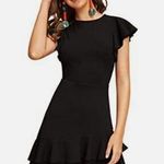 Black mini dress size small with ruffle on sleeves and buttom of the dress small Photo 0