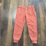 Vuori  Performance Joggers Rust Red Drawstring Pants Size Medium Photo 6