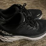 Hoka  One One women’s Black and white Athletic Shoes Photo 0