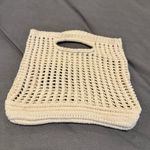 None handmade cream-colored, open-knit crochet tote bag with built-in handles. Photo 2