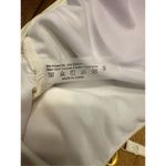 Plunge halter neck thong one piece swimsuit with metal shell medallion cream ivo Photo 5