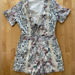 Tularosa  Rowley Floral Print Short Sleeve Front Tie Cutout Romper Photo 0