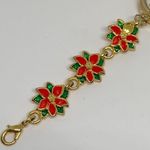 Women’s Poinsettia Quartz analog watch gold tone 25mm bracelet Size 7” running Photo 4