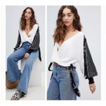 Free People  Auxton Thermal Wrap Top with a floral print Photo 1