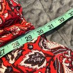 Free People  size 4 shark bite hem skirt red geometric zip back pockets on side Photo 5