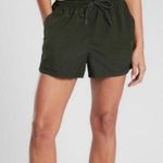 Athleta  Expedition Shorts Green Black Side Stripe Nylon Baggy Shorts 4 Photo 0