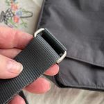 Baggallini  grey crossbody bag.  Many pockets Photo 3