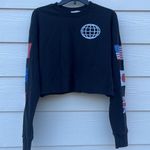 Urban Outfitters Long Sleeve Crew Neck Graphic Crop Top with Flags and raw bottom hem Photo 0
