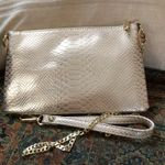 Charming Charlie Blush Metallic Snakeprint Crossbody Wristlet from Photo 2