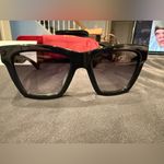 Gucci GG1714S cat-eye sunglasses with a black frame and solid grey lenses Photo 12