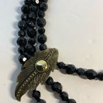 Vintage style 3 strand black beaded necklace with gold tone feather accent Photo 1