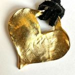 Gold tone heart pendant necklace on black cord Photo 3