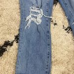 Good American Distressed Straight Leg Jeans Photo 5