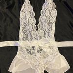 White lace lingerie with peplum skirt and bow sash Size M Photo 0