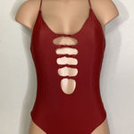 Becca New. knotted one piece. Size medium. Retails $129 Photo 0
