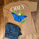 Obey  Brown Tee shirt with Blue Butterfly Graphic Photo 1