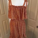 Liberty Love  tie shoulder ruffle mini dress.​ Photo 1