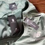 New Balance woman's sports Joggers with zips at bottom Size Large Photo 12