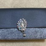 La Prarie clutch with brooch pin Photo 1