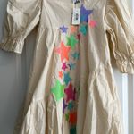 Queen of Sparkles. NWT size XS tan star dress. Photo 1