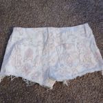 Black Orchid LasAngeles pink and white floral raw hem shorts size 27 Photo 6