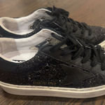 Golden Goose Women's Super-Star in black nappa and glitter with glossy black leather star Photo 1