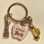 design USA Keychain - new - New York - dainty - pink apple, yellow taxi cab, silver statue of liberty. Enamel on metal. Charms are approx 1" each - see pics for measurements. Brand is . Photo 0