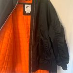 Nike therma fit women's large XL black oversized bomber jacket lined puffer oran Photo 6