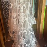 Allure Bridal  Wedding Dress Style; F239 Andi Was altered to fit me at 5’2. The dress does have a few small tears in the train which are pictured. A bustle was added to the dress the train can be tied up. Any extra fabric from being altered was also saved. Photo 5