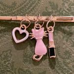 Charming Gold Hair Clip with Pink and Black Charms Photo 0