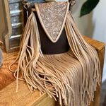 Deep brown and golden browns are stunning on this leather crossbody purse. Photo 13