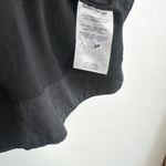 Reformation  | Oakley Peplum Collared Fitted Vest with Velvet Buttons in Black Photo 10