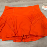 Free people movement skort, NWT! Orange Size M Photo 0