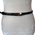Women's black skinny adjustable leather belt with silver buckle Photo 1