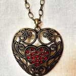 Brass tone red rhinestone heart pendant necklace Photo 0