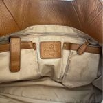 Tan Leather Shoulder Bag with Gold Hardware and Structured Shape Photo 3