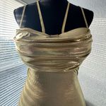 Gold fitted dress with elegant design and double straps. Photo 2