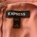 EXPRESS -FAUX WRAP MINI DRESS-SIZE XS V neck, faux wrap front, long sheer sleeves, ruched skirt with ruffles down the side, tiered ruffle hem, metallic fit fabric, fully lined except for sleeves, excellent condition, like new Measurements: Bust: armpit to armpit 16 1/2 inches Waist: side to side 13 inches Length: shoulder seam to bottom 32 inches Photo 14