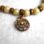 Source Unknown Rose Gold White Beaded Rhinestone Accent Charm Stretch Gently Worn Bracelet Photo 1