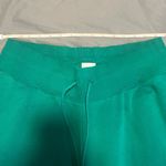 Nike  Women's Phoenix Fleece Oversized Pant in Malachite/Sail Photo 8