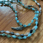 Alexa's Angel's‎ wing String Blue Photo 0
