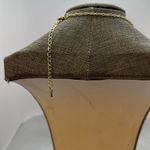 Adorable, gold tone necklace with a turtle the eyes are glass.​ Photo 2