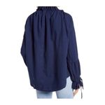 Free People  We The Free Alpine Denim Top Medium Cotton Tiered Bell Sleeve Blue Photo 1