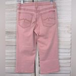 Jeanstar Gently used and in great condition. High rise, cropped jeans with flared hem. White & washed blue stripes. -5 pocket style -Front zip/button closure -98% cotton/2% elastane -Waist measures 13" across, rise is 10" and inseam is 24.5". -Flared hem measures 7.5" across Photo 1