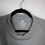 Women's The Nike Tee Oversized Fit Cotton Graphic Print Tee Shirt Gray M Photo 1